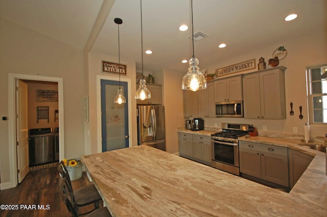 8737 N Mare St, Prescott Valley, AZ 86315 - kitchen with appliances with stainless steel finishes, hanging light fixtures, recessed lighting, light stone counters, and a peninsula