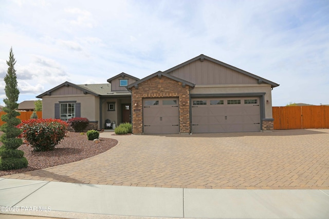 8737 N Mare St, Prescott Valley, AZ 86315 - craftsman inspired home featuring stone siding, an attached garage, driveway, a gate, and stucco siding