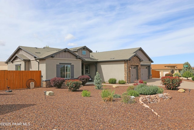 8737 N Mare St, Prescott Valley, AZ 86315 - craftsman-style house with board and batten siding, a garage, and concrete driveway
