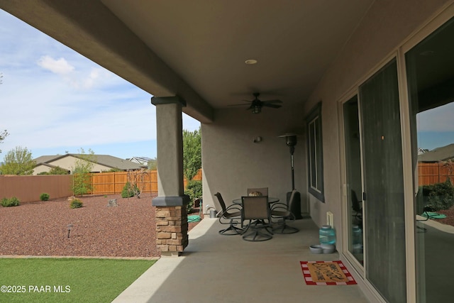 8737 N Mare St, Prescott Valley, AZ 86315 - fenced backyard with a ceiling fan, a patio, and outdoor dining space