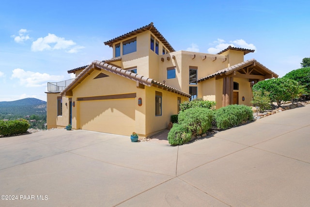 2253 Shadow Ridge Rd, Prescott, AZ 86305 - view of front of home with concrete driveway, stucco siding, an attached garage, and a tile roof