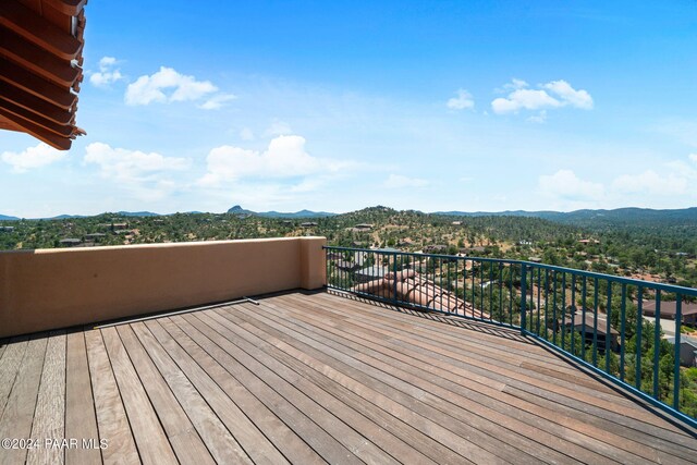 wooden deck with a mountain view