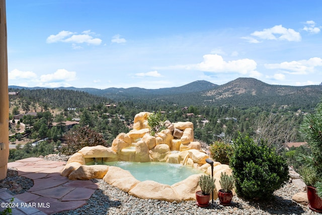 2253 Shadow Ridge Rd, Prescott, AZ 86305 - view of swimming pool featuring a mountain view and a wooded view
