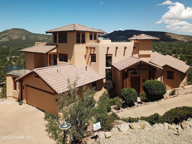 2253 Shadow Ridge Rd, Prescott, AZ 86305 - view of front facade featuring a tiled roof, a mountain view, and stucco siding
