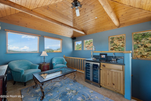 living area with lofted ceiling with beams, wooden ceiling, beverage cooler, and indoor wet bar