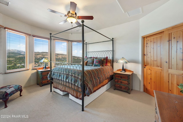 carpeted bedroom with ceiling fan