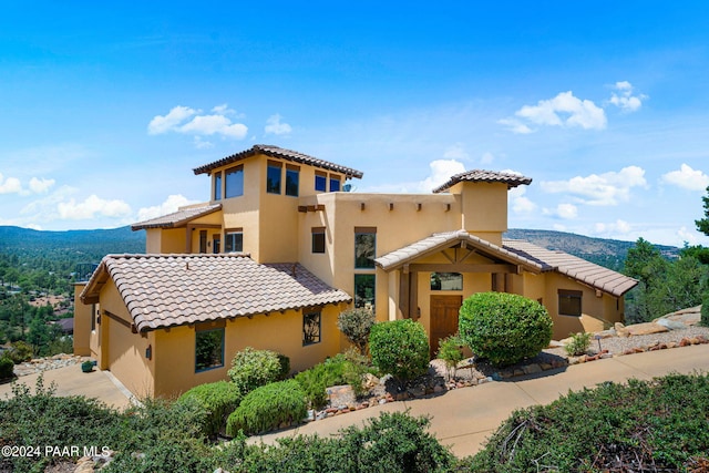 mediterranean / spanish home featuring a mountain view