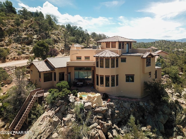 2253 Shadow Ridge Rd, Prescott, AZ 86305 - back of property featuring stucco siding, a patio area, a tile roof, and a balcony