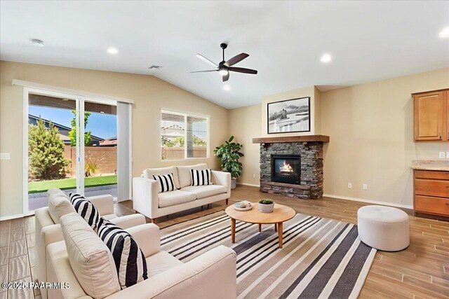 1364 Towhee Trl, Prescott, AZ 86305 - living room with light wood finished floors, ceiling fan, lofted ceiling, a fireplace, and baseboards