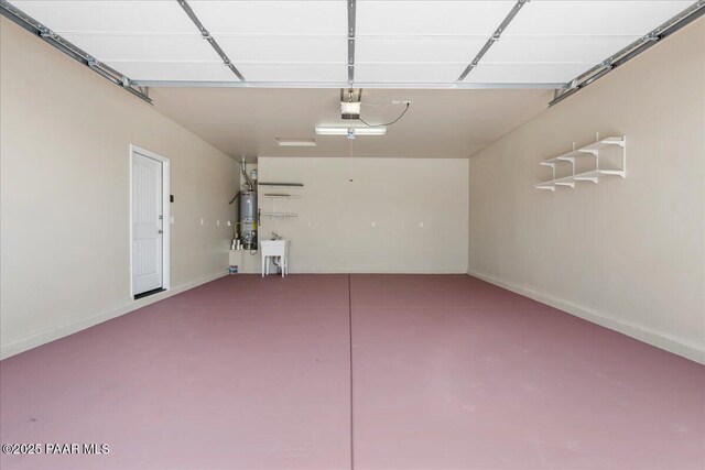 1364 Towhee Trl, Prescott, AZ 86305 - garage featuring gas water heater, a sink, baseboards, and a garage door opener