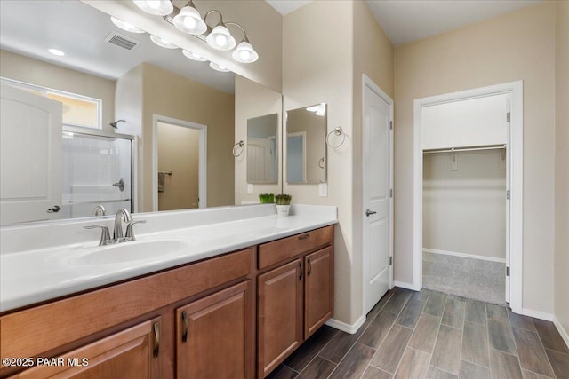 1364 Towhee Trl, Prescott, AZ 86305 - full bath with a stall shower, vanity, a spacious closet, wood finished floors, and baseboards