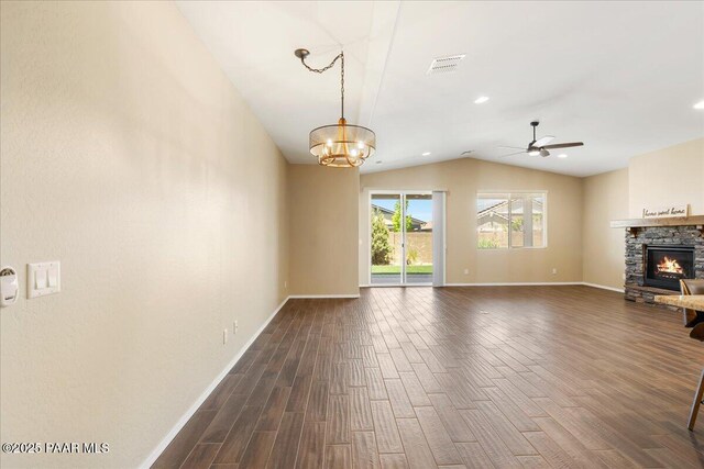 1364 Towhee Trl, Prescott, AZ 86305 - unfurnished living room with lofted ceiling, dark wood-style flooring, a fireplace, baseboards, and a ceiling fan