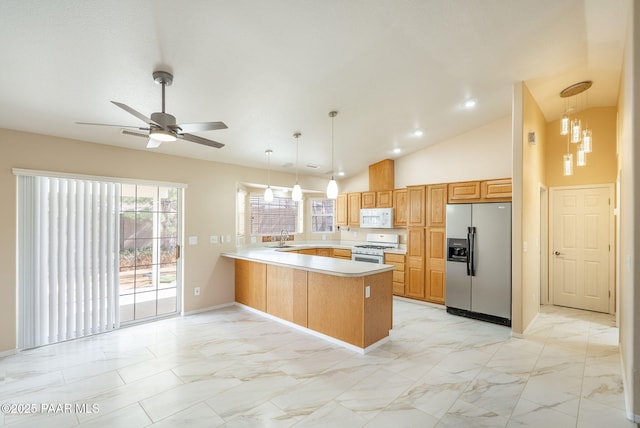 kitchen featuring light countertops, a peninsula, marble finish floor, white appliances, and a sink