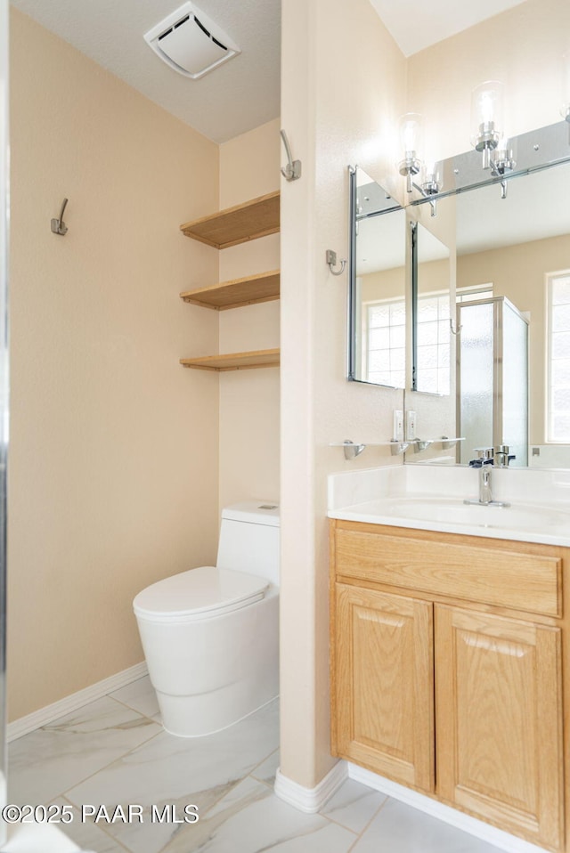 bathroom with visible vents, toilet, a stall shower, marble finish floor, and vanity