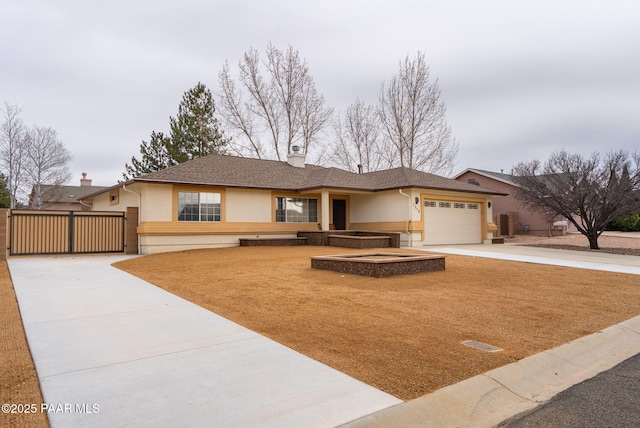 ranch-style house with a garage, driveway, and stucco siding