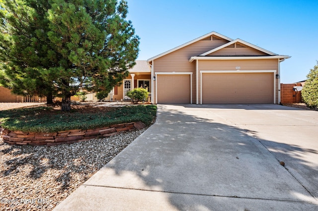 7876 N Siesta Sunset Ln, Prescott Valley, AZ 86315 - view of front of house featuring a garage, fence, and driveway