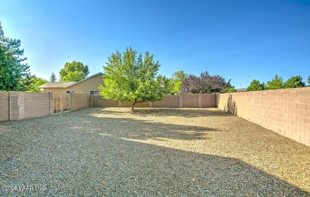 7876 N Siesta Sunset Ln, Prescott Valley, AZ 86315 - view of yard featuring a fenced backyard