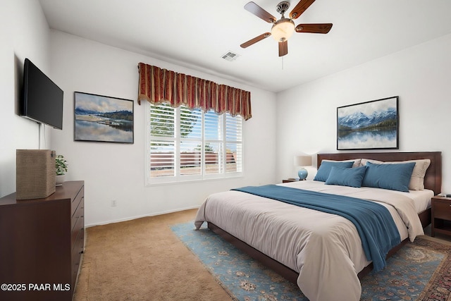 7876 N Siesta Sunset Ln, Prescott Valley, AZ 86315 - bedroom with visible vents, a ceiling fan, baseboards, and light colored carpet