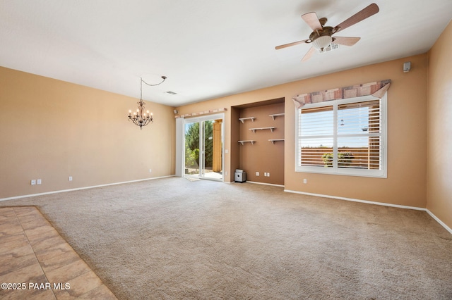 7876 N Siesta Sunset Ln, Prescott Valley, AZ 86315 - carpeted spare room featuring baseboards and ceiling fan with notable chandelier