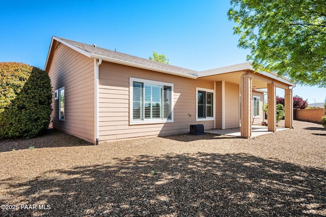 7876 N Siesta Sunset Ln, Prescott Valley, AZ 86315 - back of property featuring a patio and roof with shingles