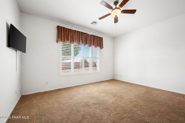 7876 N Siesta Sunset Ln, Prescott Valley, AZ 86315 - unfurnished room featuring carpet flooring, a ceiling fan, baseboards, and visible vents
