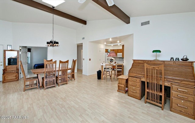 dining area with light wood-type flooring, visible vents, beam ceiling, high vaulted ceiling, and an inviting chandelier