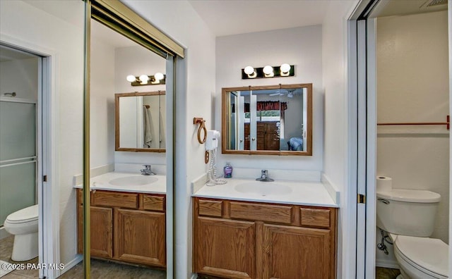 full bath featuring connected bathroom, toilet, and vanity