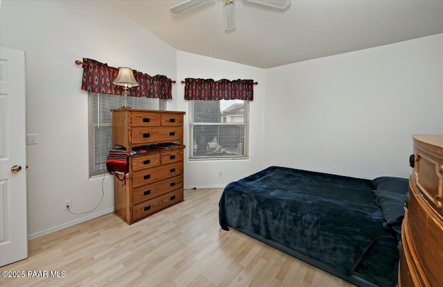 bedroom with wood finished floors, baseboards, and ceiling fan