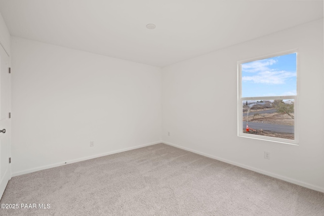 unfurnished room featuring carpet