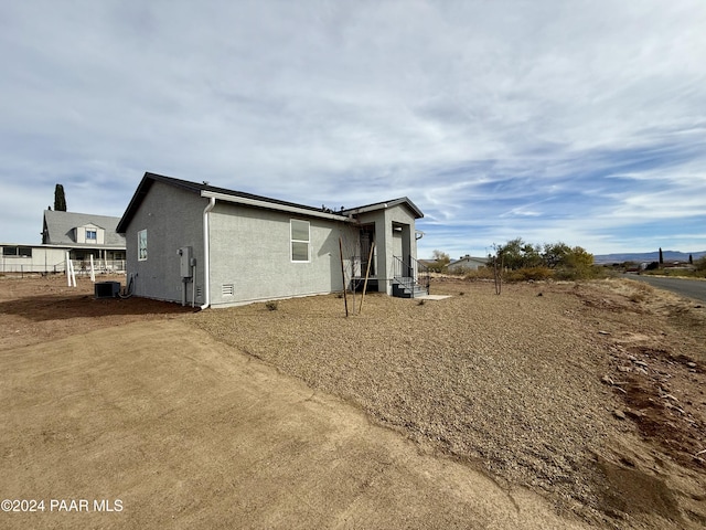 19996 E Ocotillo Dr, Mayer, AZ 86333 - back of house with stucco siding and cooling unit