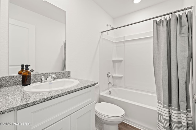 full bathroom with vanity, shower / bathtub combination with curtain, and toilet