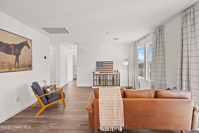 living room with dark hardwood / wood-style flooring