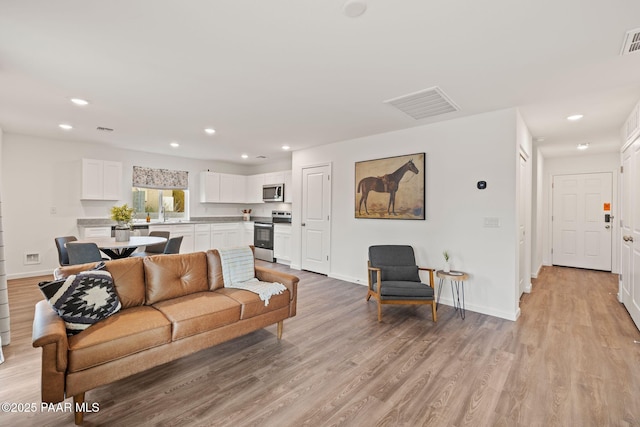 living room featuring light hardwood / wood-style flooring