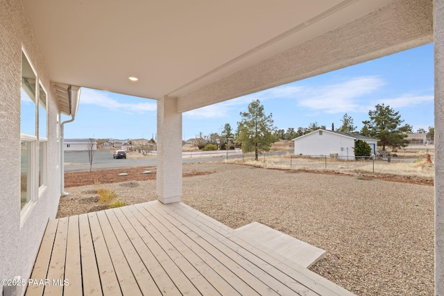 wooden terrace with a patio