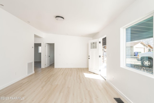 unfurnished room with light hardwood / wood-style floors