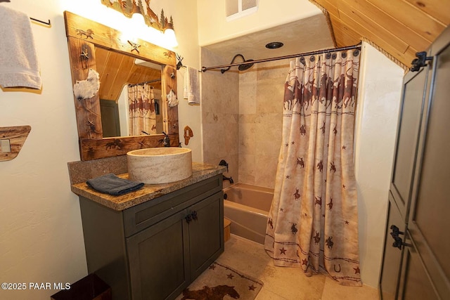 bathroom with vanity and shower / tub combo with curtain