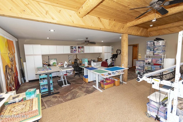 game room featuring ceiling fan, wooden ceiling, and dark colored carpet