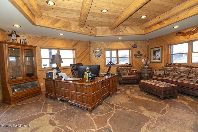 office area with beamed ceiling, a raised ceiling, wood ceiling, and wooden walls