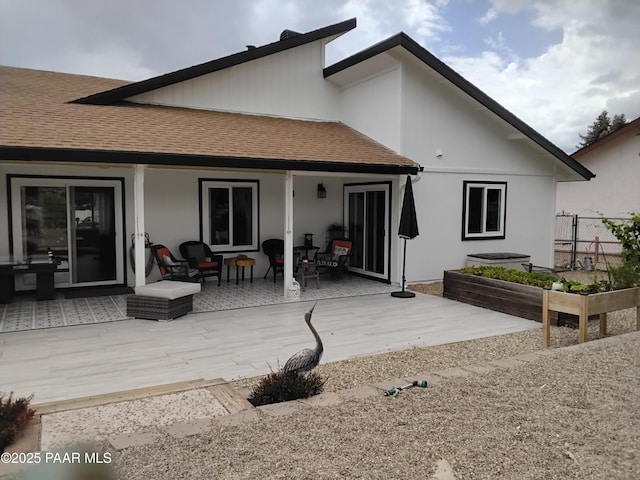 11040 Singletree Trl, Dewey-Humboldt, AZ 86327 - rear view of house with a shingled roof, a garden, a patio, and stucco siding