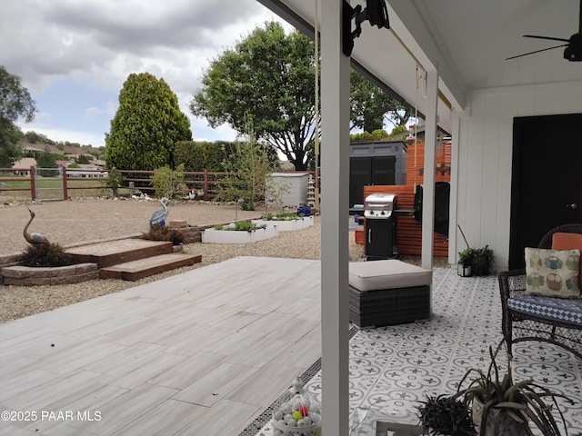 11040 Singletree Trl, Dewey-Humboldt, AZ 86327 - deck featuring a ceiling fan, grilling area, a patio area, and a fenced backyard