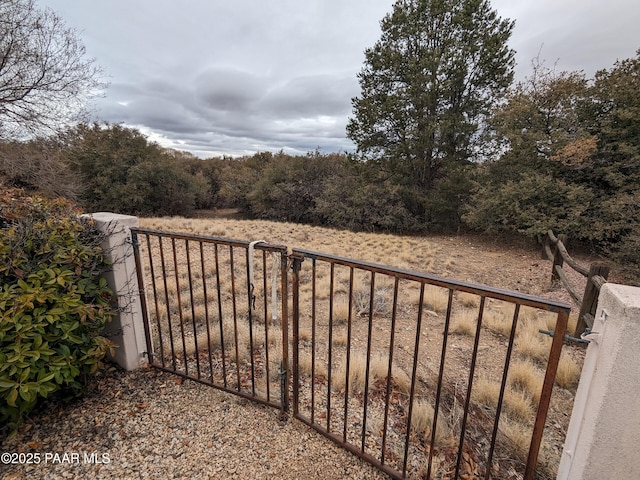 view of gate featuring fence