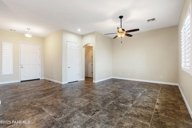 6380 E Deacon St, Prescott Valley, AZ 86314 - empty room featuring arched walkways, ceiling fan, baseboards, and recessed lighting