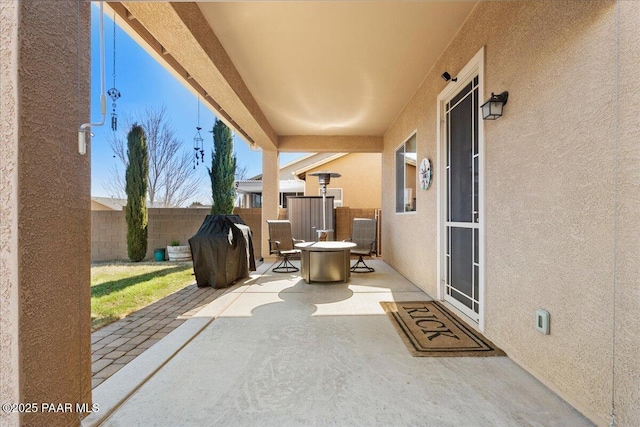 view of patio / terrace with fence