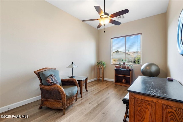 office with light wood-type flooring, baseboards, visible vents, and ceiling fan