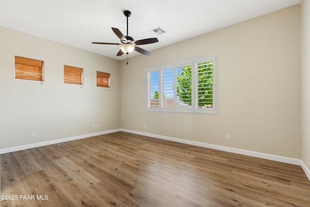 6380 E Deacon St, Prescott Valley, AZ 86314 - empty room with light wood-style flooring, ceiling fan, and baseboards