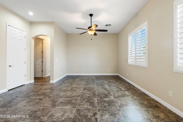 6380 E Deacon St, Prescott Valley, AZ 86314 - unfurnished room featuring ceiling fan, arched walkways, and baseboards
