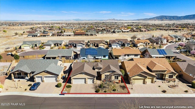 aerial view featuring a mountain view and a residential view
