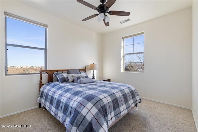 6969 E Encampment Dr, Prescott Valley, AZ 86314 - bedroom featuring multiple windows, light colored carpet, and ceiling fan