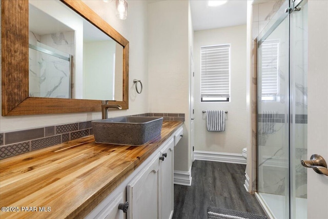 6969 E Encampment Dr, Prescott Valley, AZ 86314 - bathroom with radiator heating unit, wood-type flooring, vanity, walk in shower, and toilet