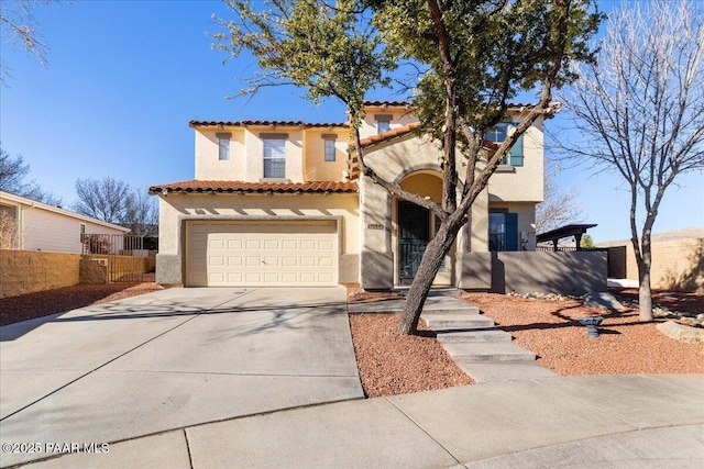 mediterranean / spanish-style house featuring a garage